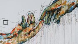 A mural of two multicolored hands reaching out to each other on a white wall