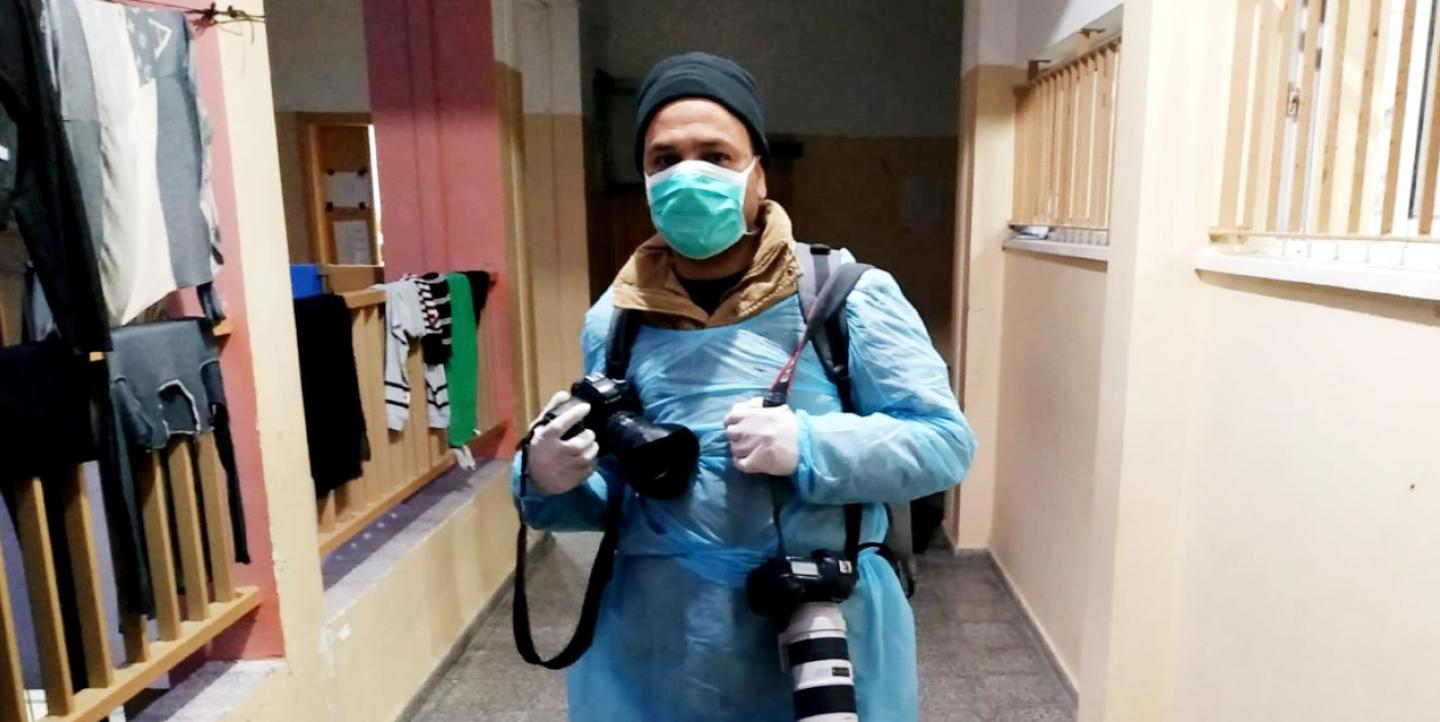 Photojournalist in protective equipment