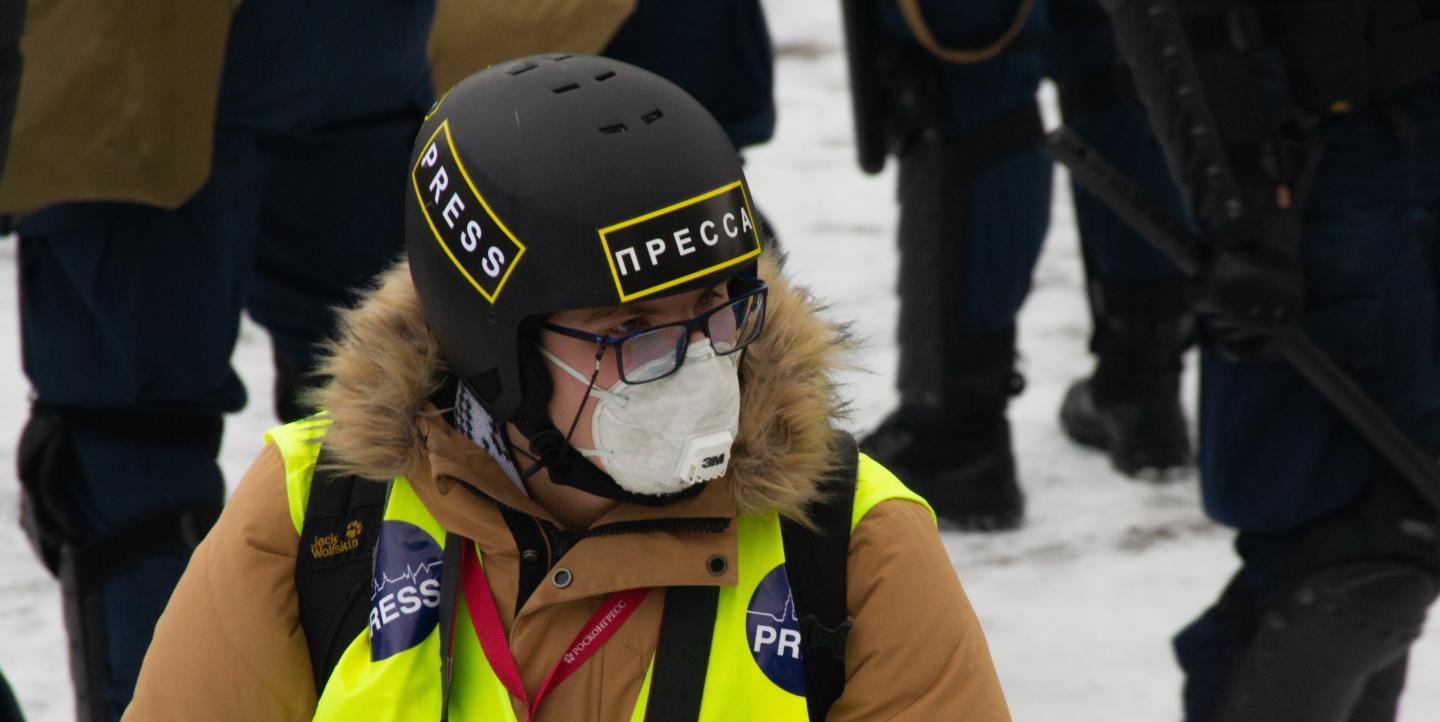 Russian journalist with Press helmet