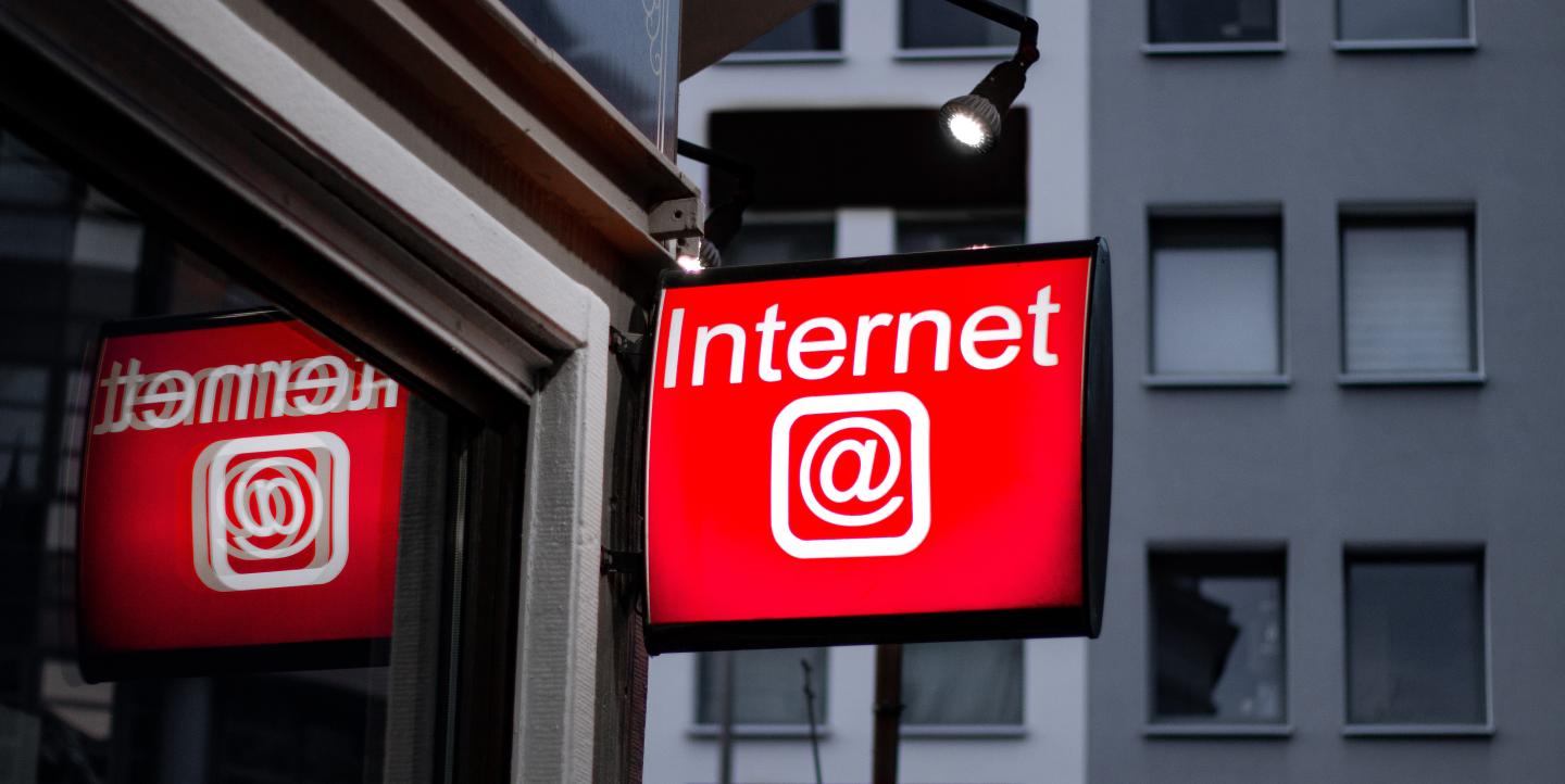 Red sign with the @ symbol and the word Internet on it. 