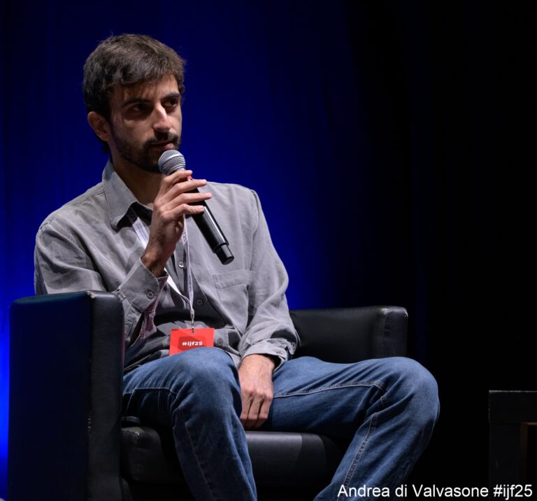Yuval Abraham holding a mic.