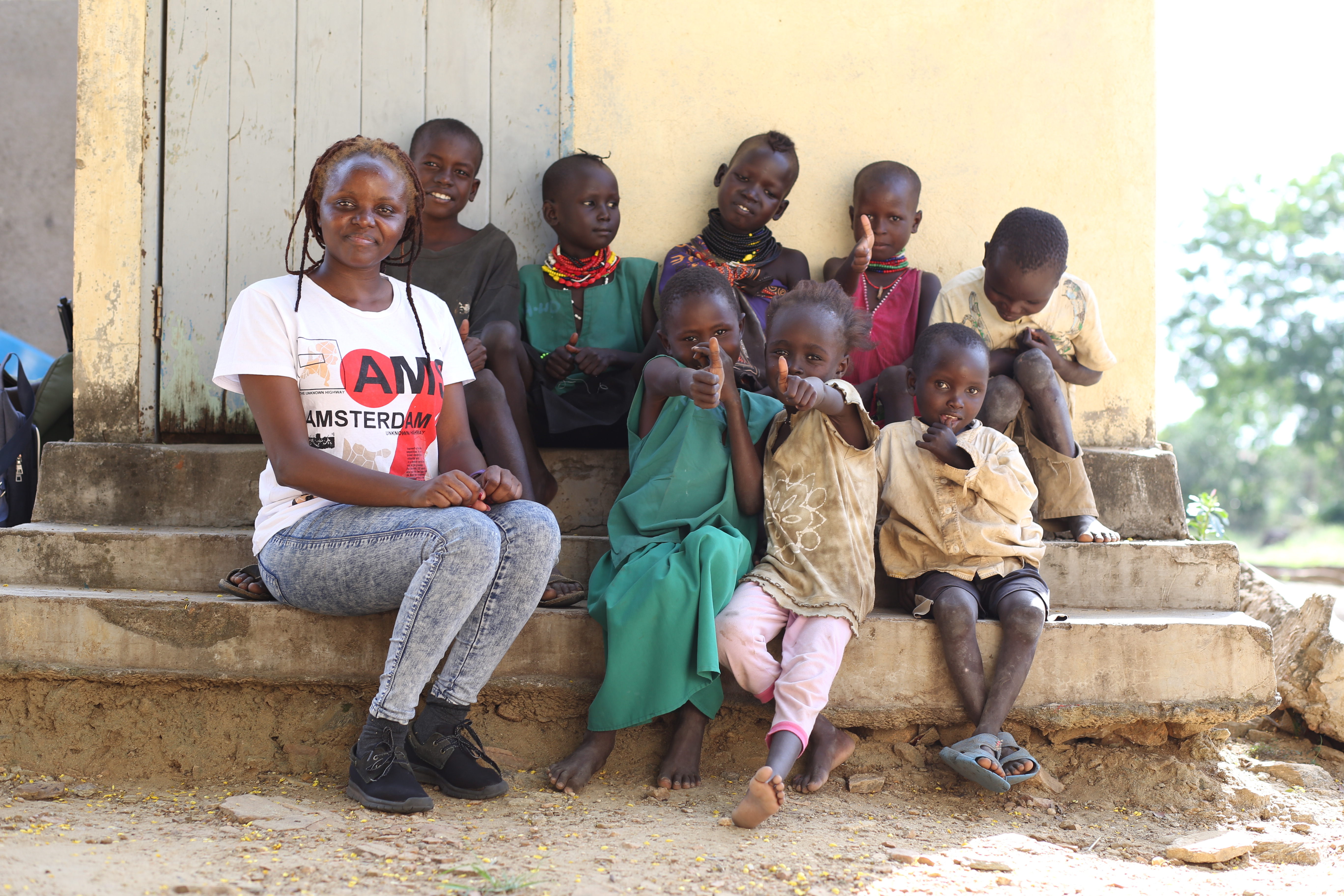 Okeyo with children who have survived the treatment of kalaazar.