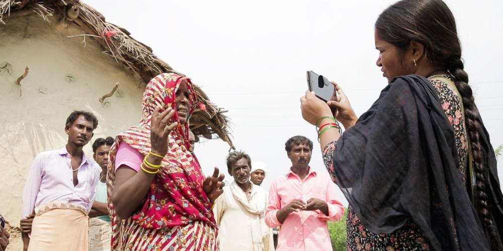 Mera Devi, one of the reporters at Khabar Lahariya, records a story