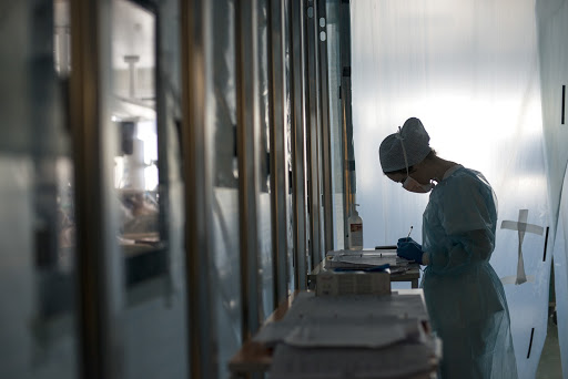 In the intensive care unit of the Sant’Orsola Hospital in Bologna, Italy, a nurse updates the health data for patients who tested positive for COVID-19. (credit: Michele Lapini). 