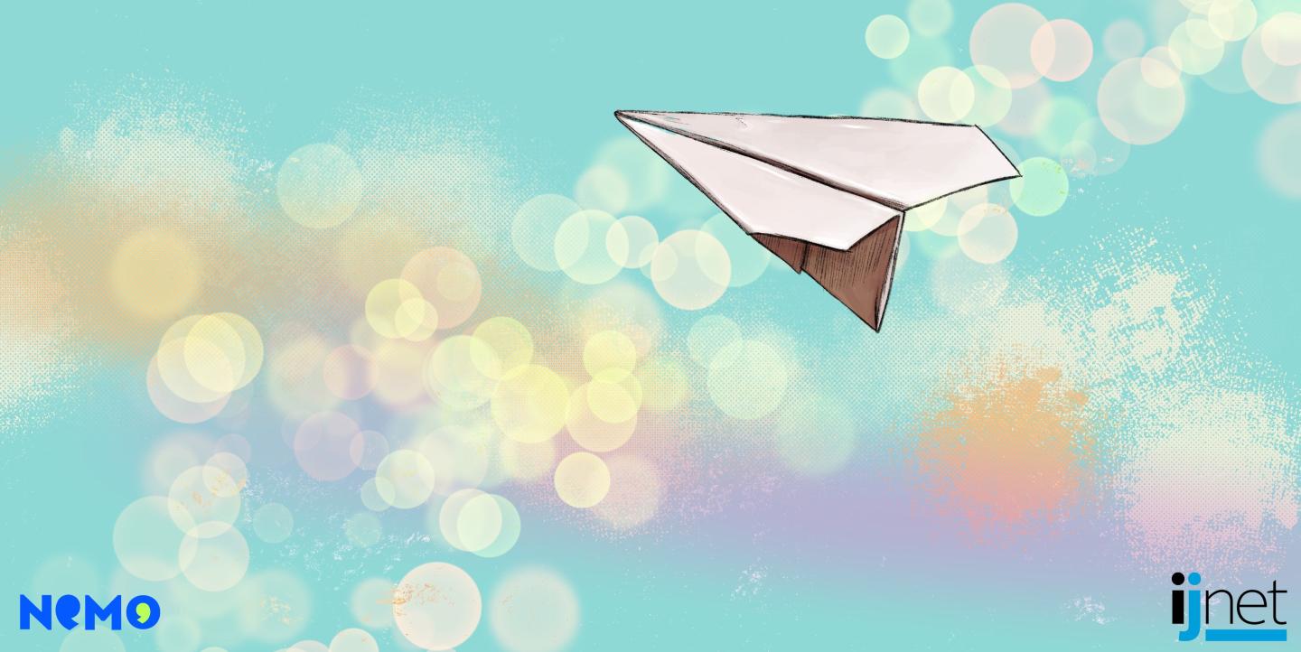 Paper airplane flying through the sky