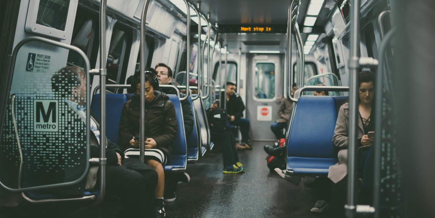 People riding metro