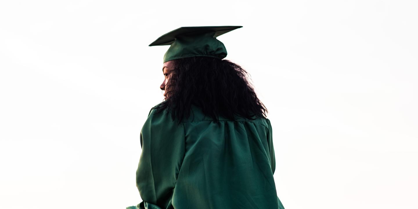 Black woman in a graduation gown