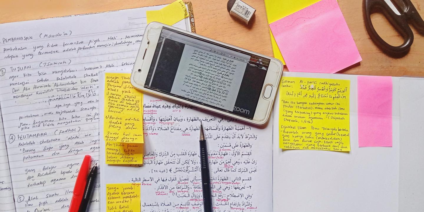 Phone and notes on a desk