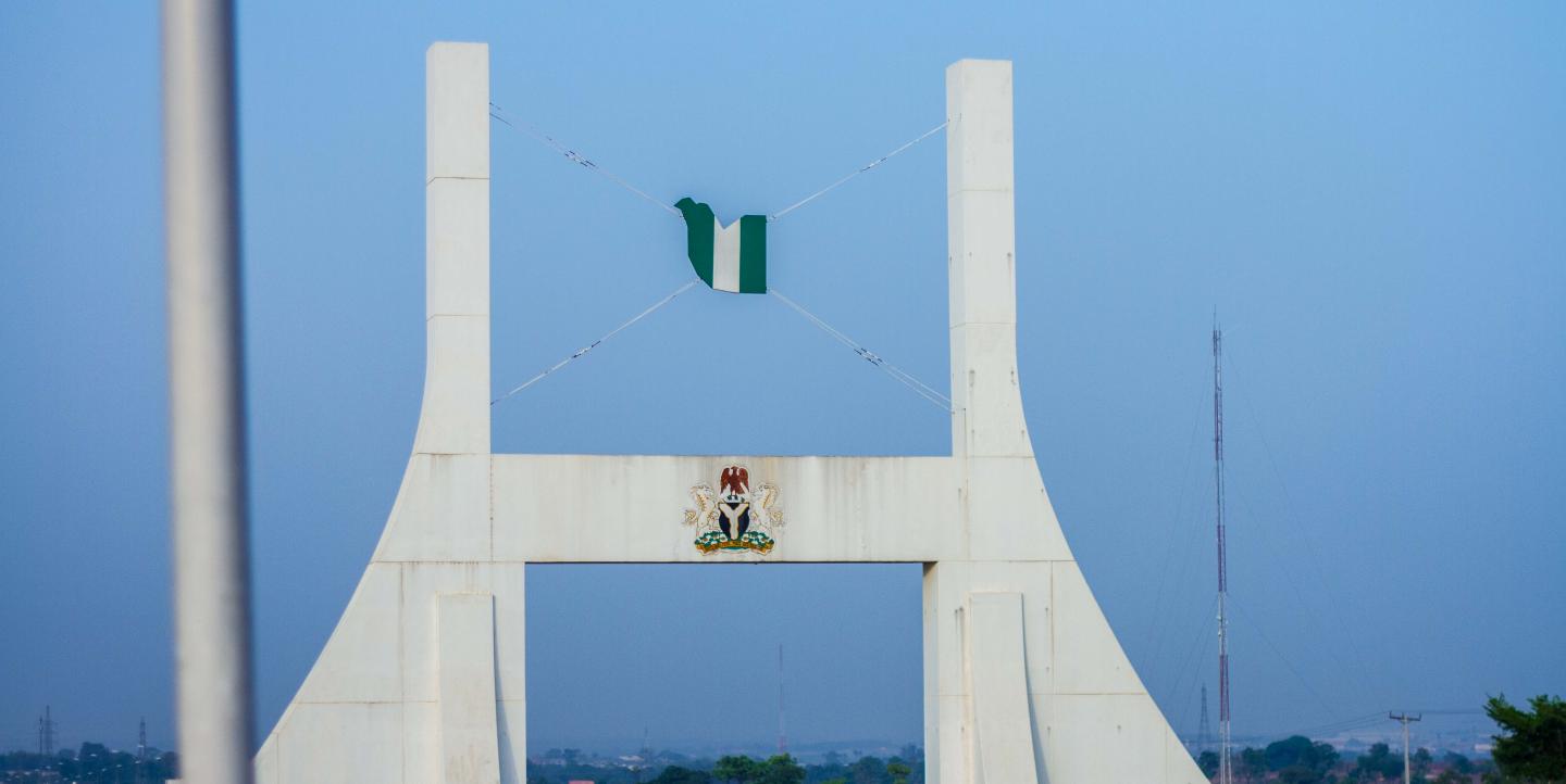 Abuja Gate in Abuja, Nigeria, flying Nigerian flag