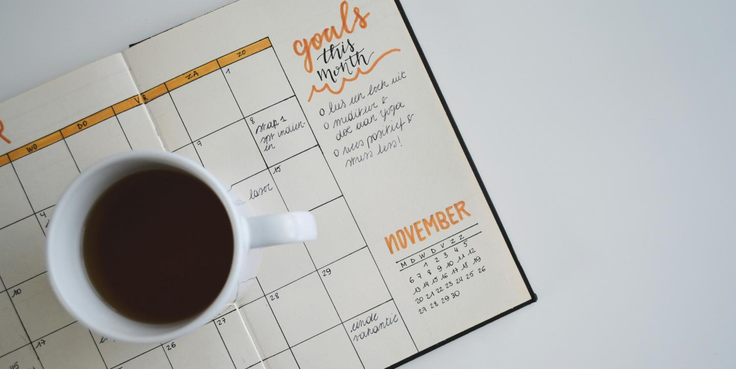 Calendar with a cup of coffee on it