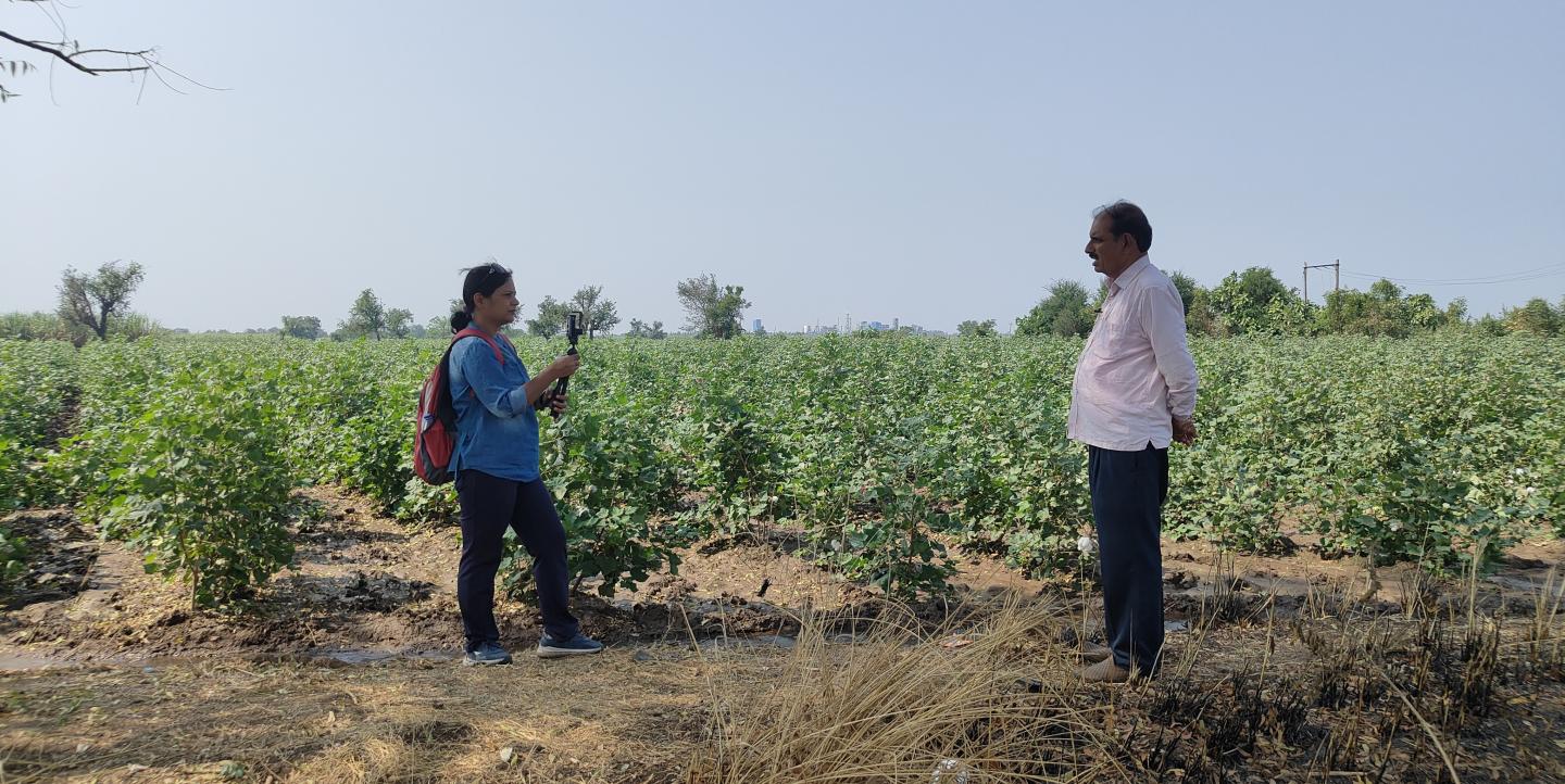 Singh interviewing a cotton farmer.