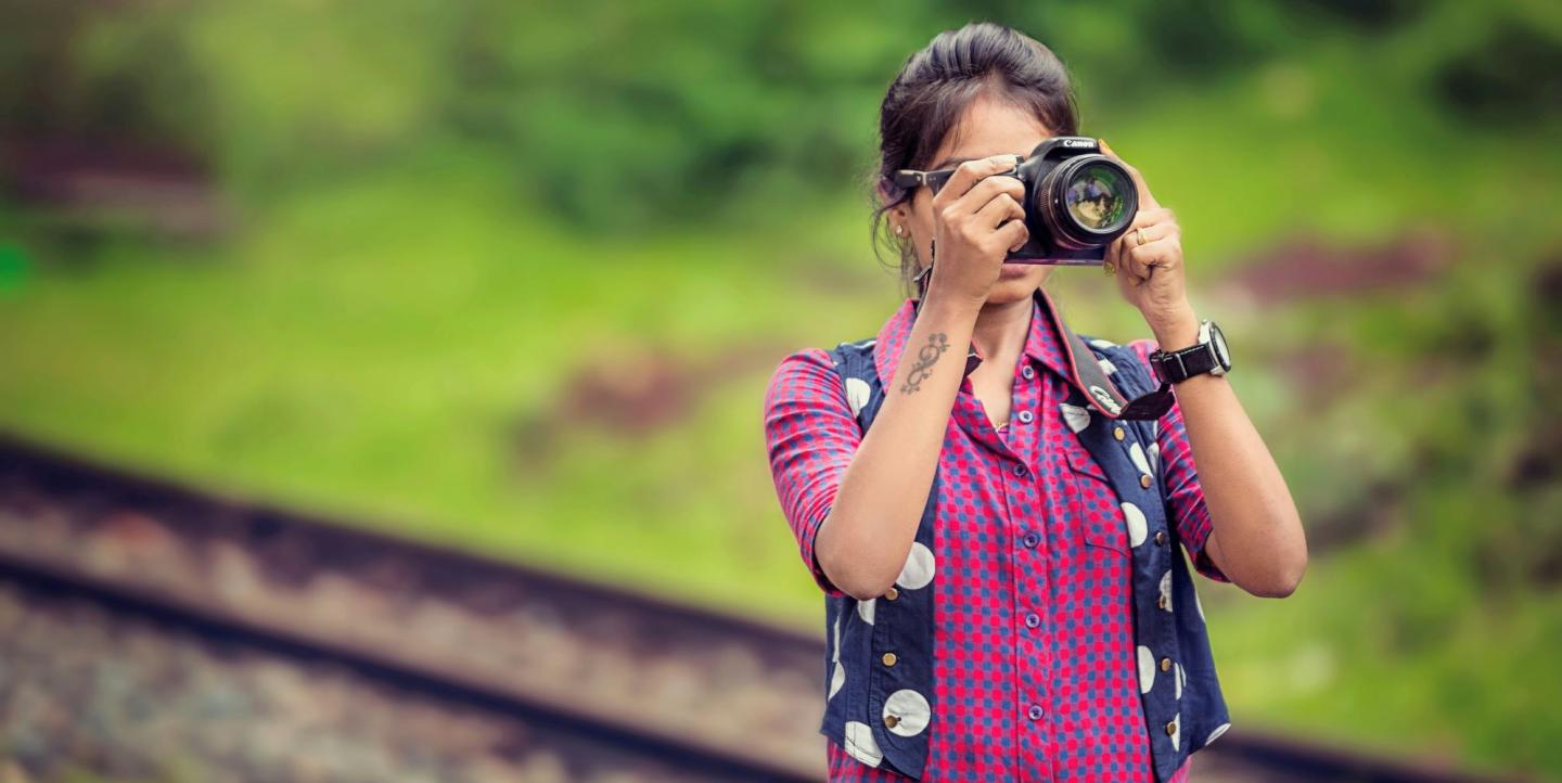 Indian woman with camera