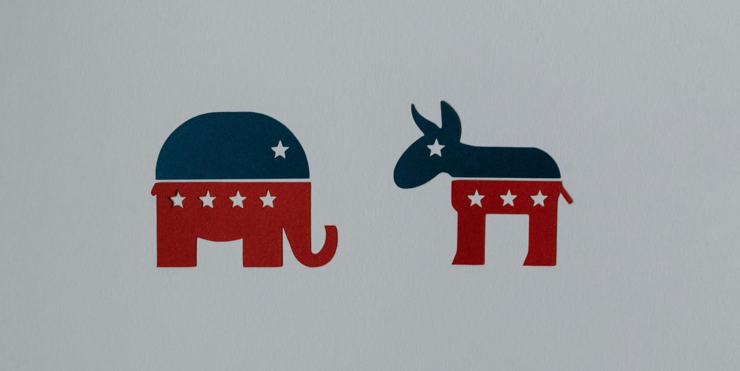 Republican elephant and democrat donkey in red white and blue