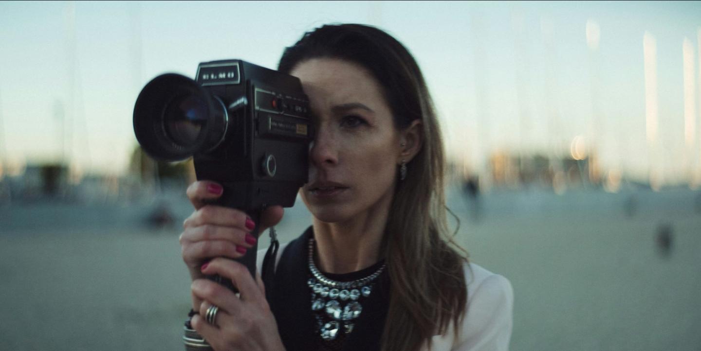 Woman holding a film camera