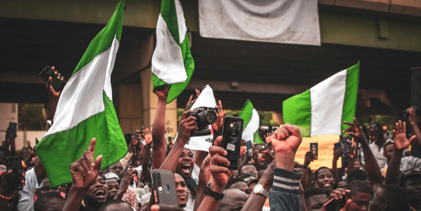 People holding NIgerian flags during a protest