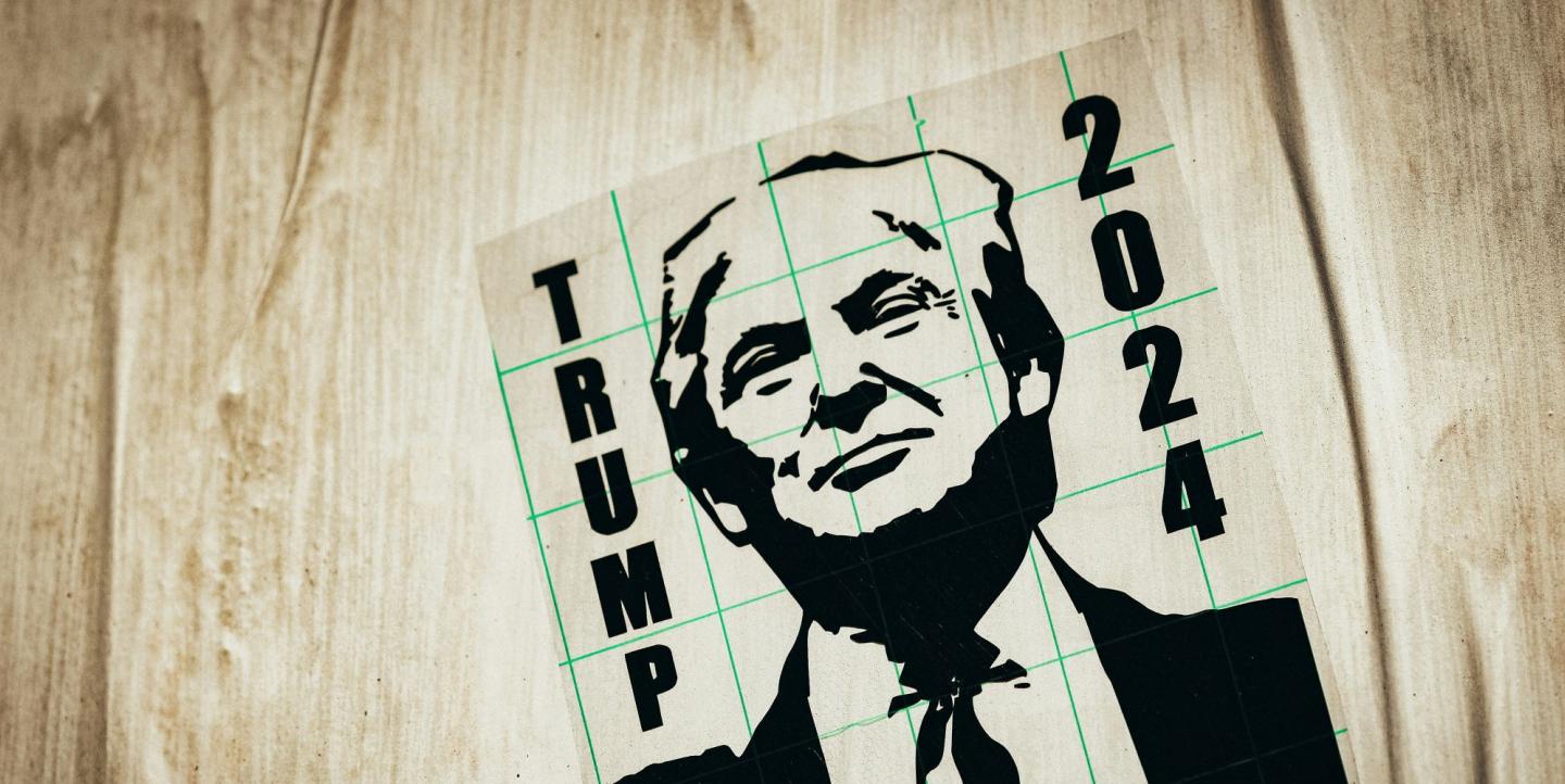 Poster reading "trump 2024" with Trump's face on it