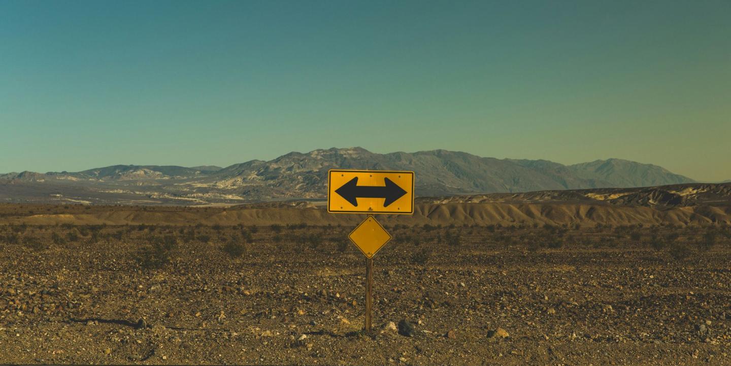 Sign pointing tow ways in the desert