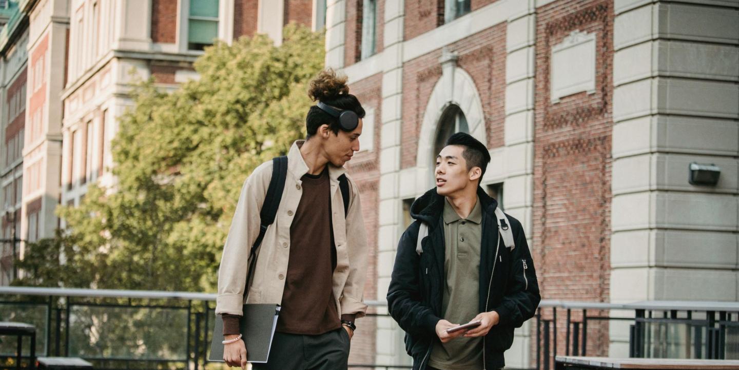 Two students walking and talking