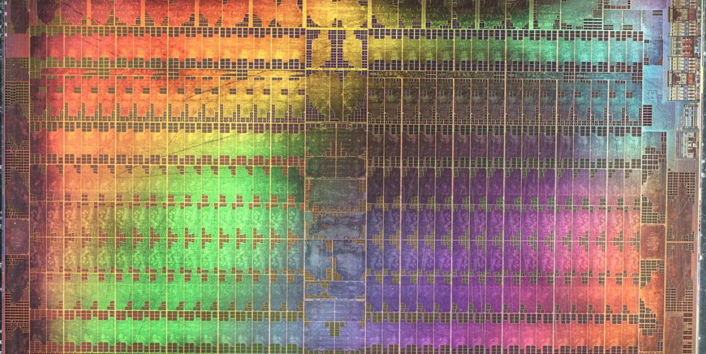 Abstract microscopic photography of a Graphics Processing Unit in rainbow colors