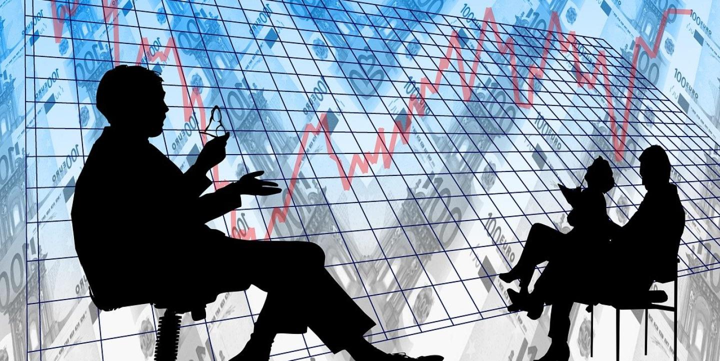 A graph, currency and silhouettes of three people