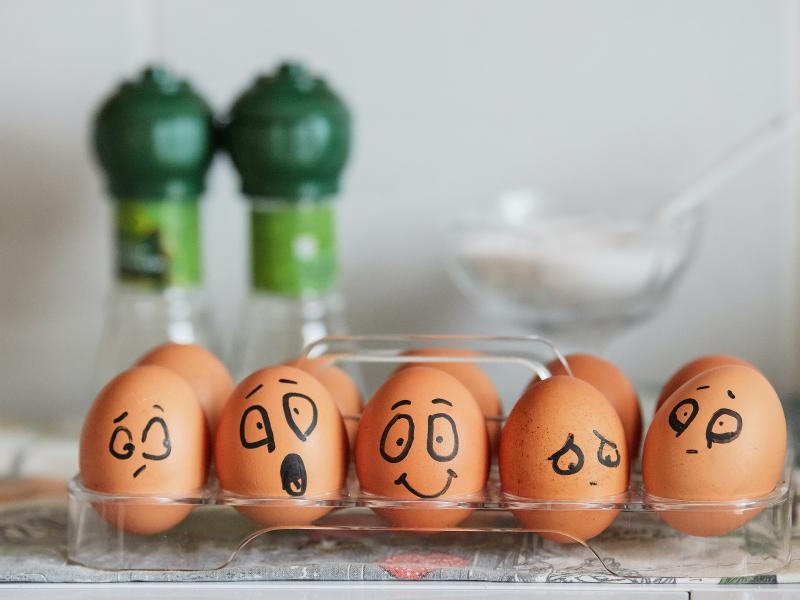 Eggs painted to show a variety of emotions