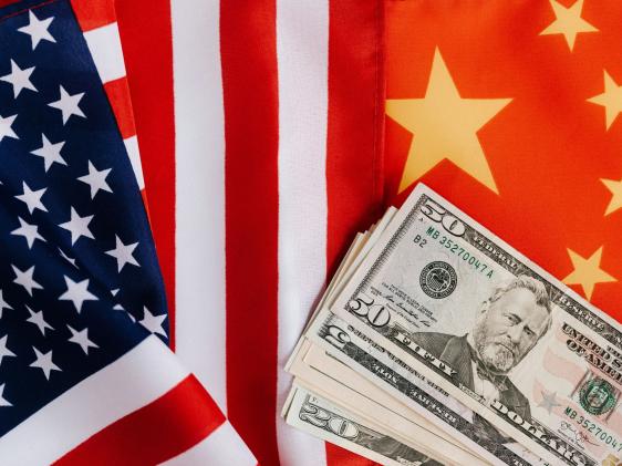 US, China flags and money