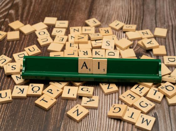 Scrabble pieces that spell AI.