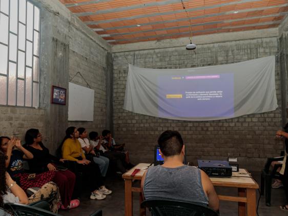 Ascarza teaching church community members.