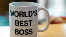 White mug that reads "World's Best Boss"