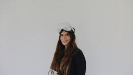 hadeel wearing VR headset in front of white background
