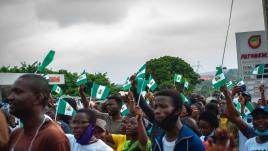 Nigerians waving flags.