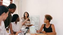 Women discussing around a table