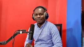  Facely Konaté with headphones and a microphone.