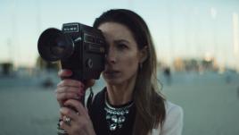Woman holding a film camera
