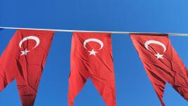 Three turkey flags on a clothesline 