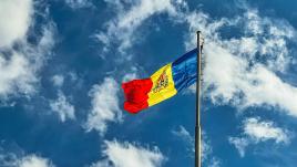 Red yellow and blue flag blowing in the sky